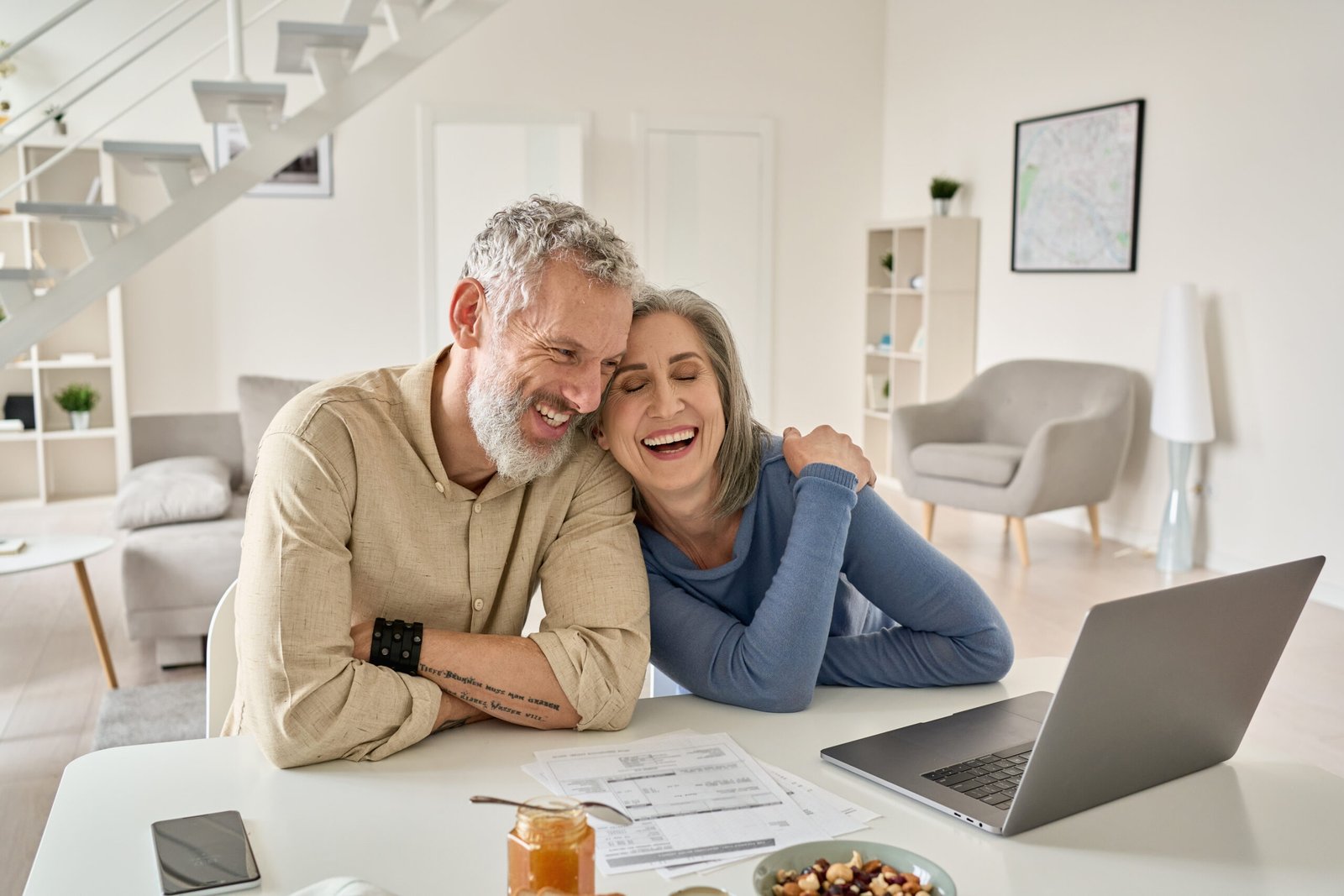 Bingham-Law-Group-Lander-2 Older Couple Smiling at Laptop