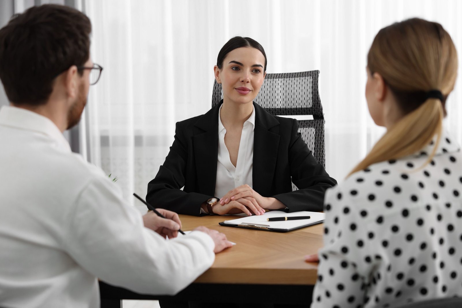 Bingham-Law-Group-Meridian-2 Couple Facing Attorney