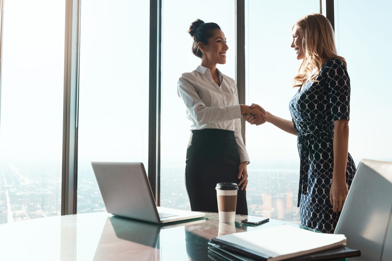 Bingham-law-Group-Preston-4 Women Shaking Hands
